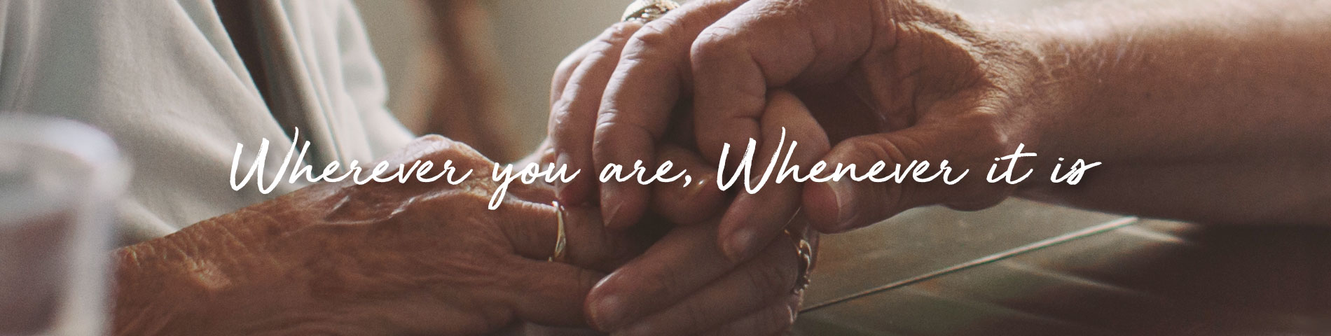 Close-up of hands holding together in a caring moment