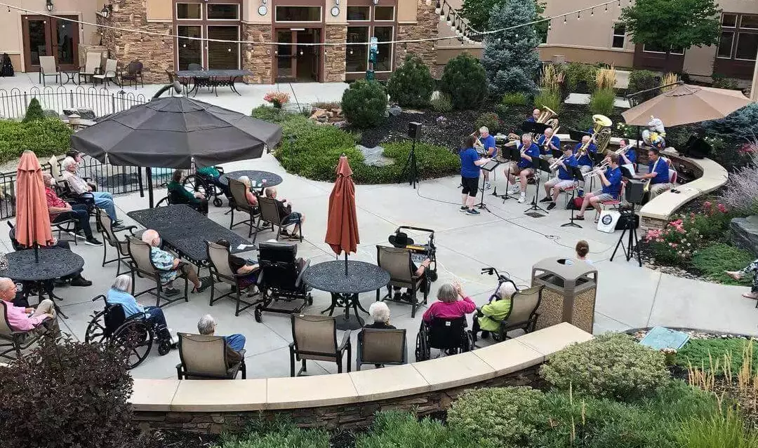 Residents enjoying live music in the outdoor courtyard