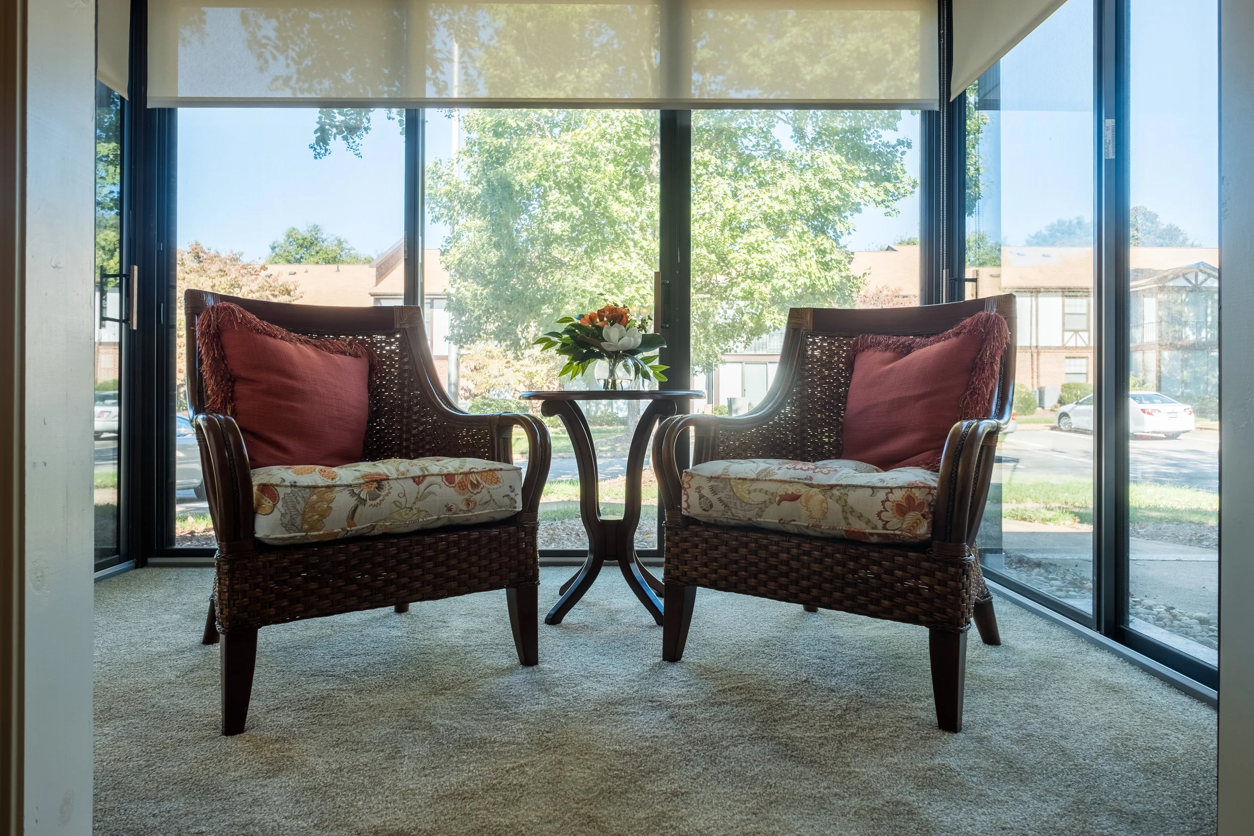 Cozy seating area with chairs and a table in a sunlit space