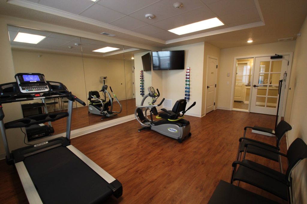 A fitness room with exercise equipment