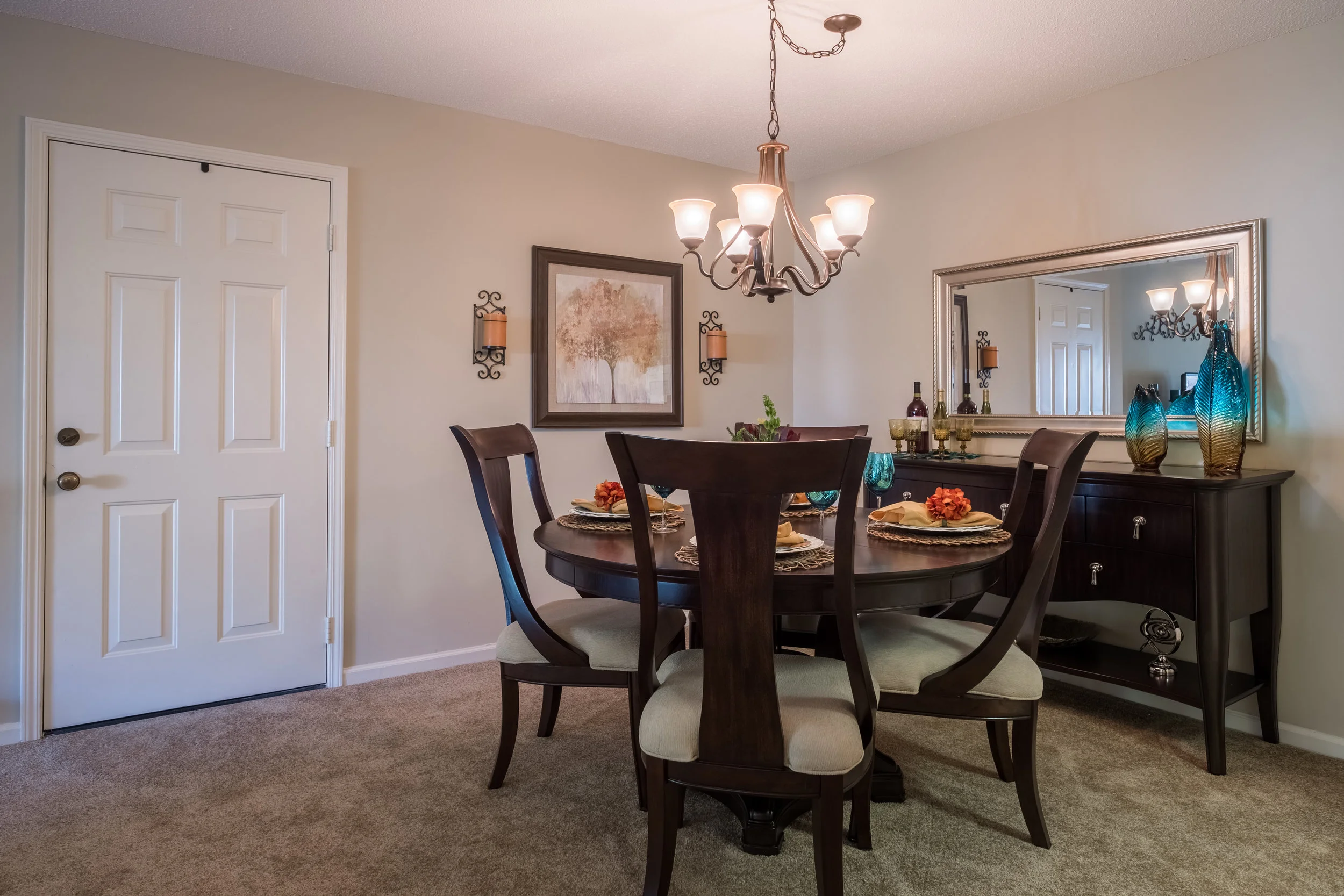 Well-decorated dining room with table and chairs
