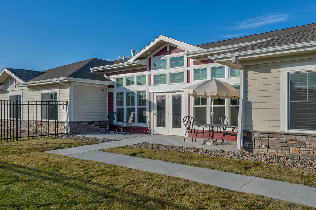 Exterior view of a building with outdoor seating area