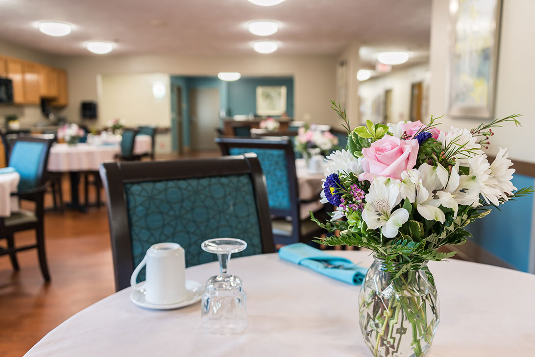 Bright dining room with floral centerpiece
