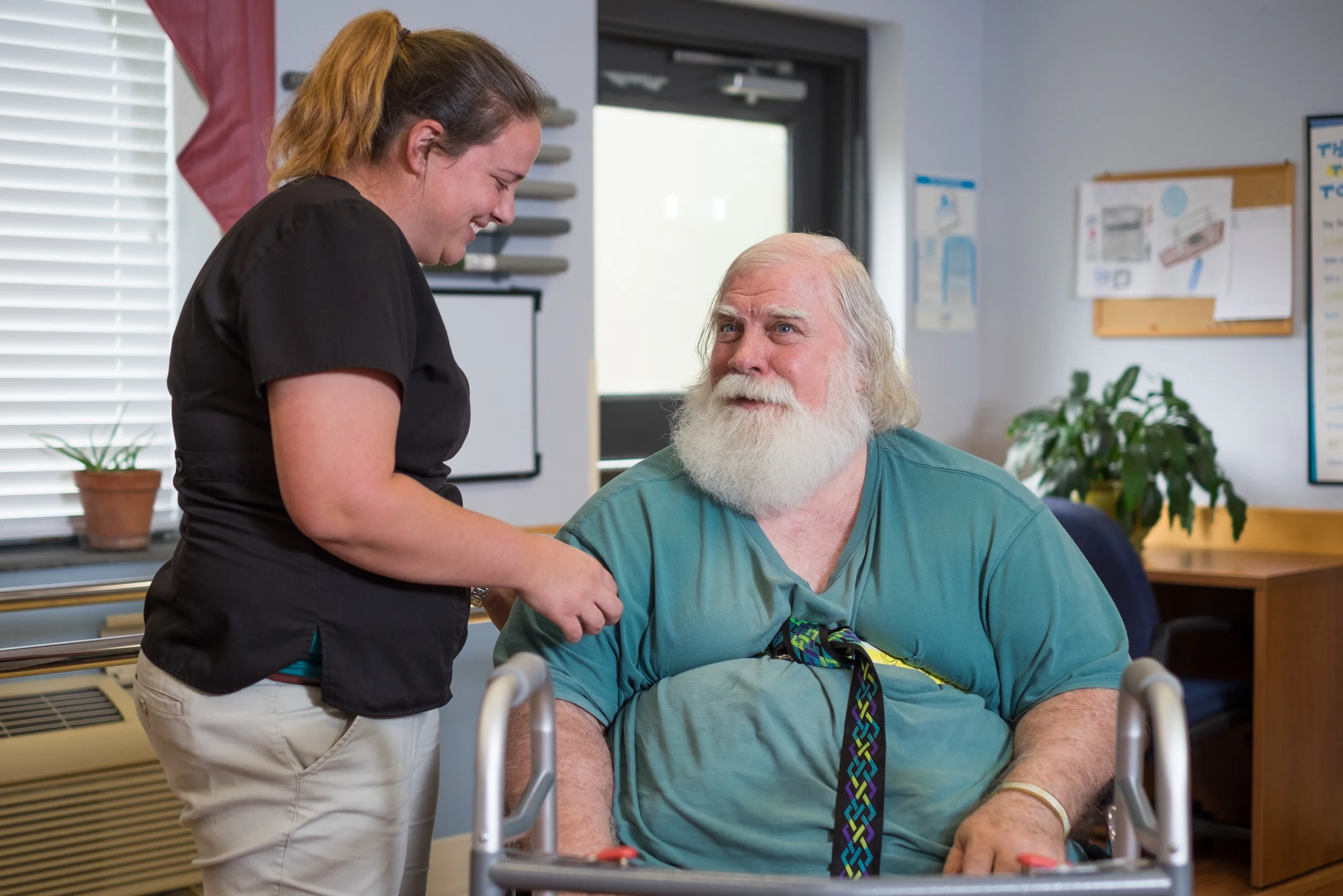 Staff member interacting with a resident in a communal area