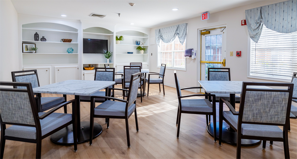 Bright common area with tables and chairs
