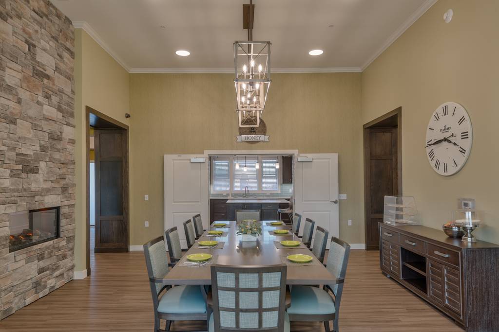 Bright dining room with a large communal table and decor