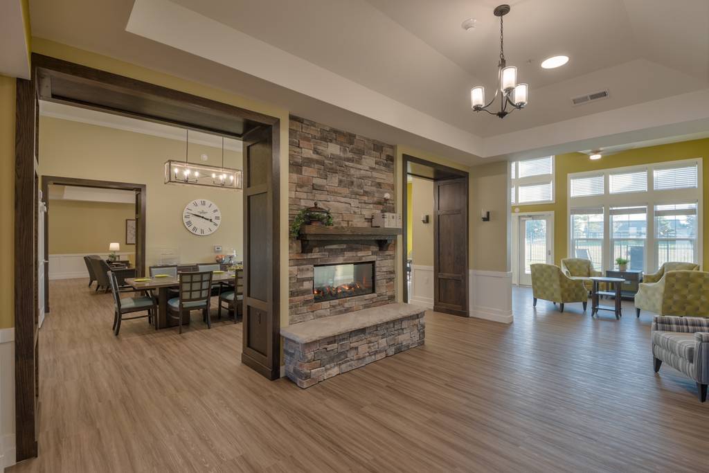 Interior view of a common area with seating and a fireplace