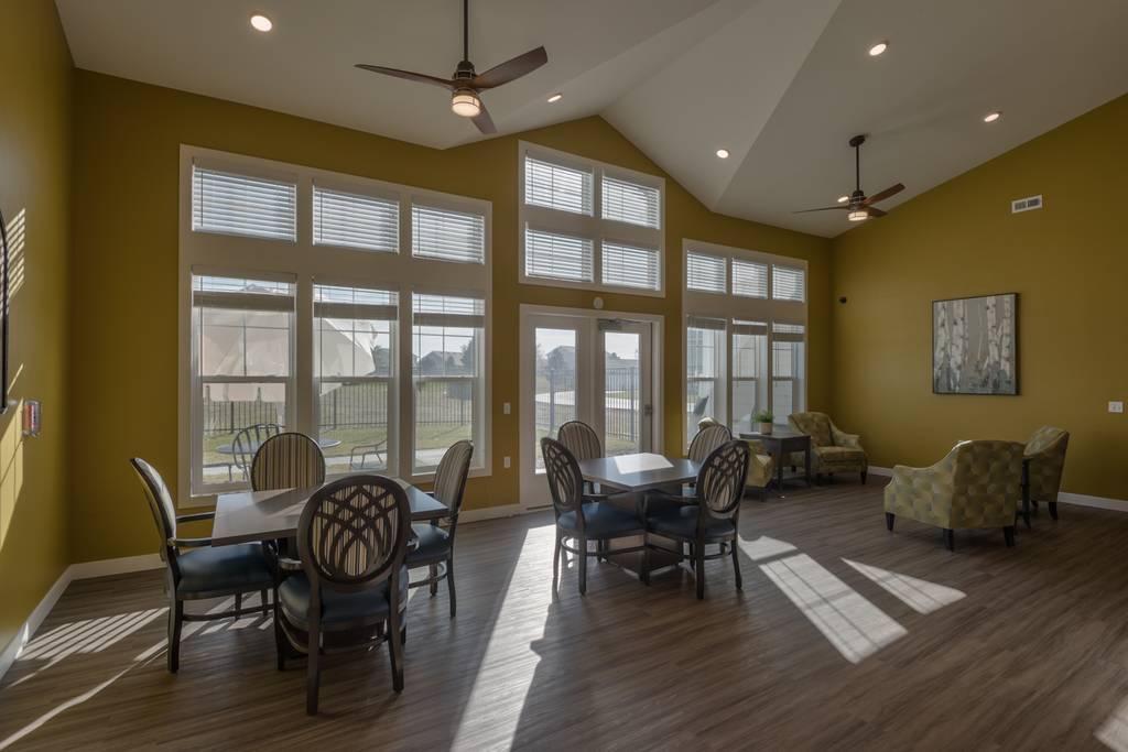 Bright interior common area with seating and windows