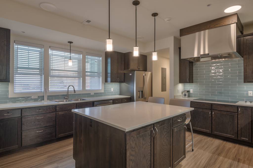 Modern kitchen area with island and seating
