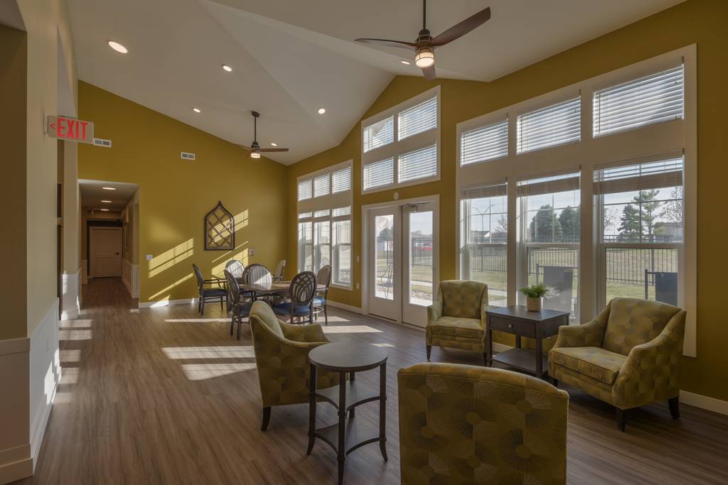 Bright common area with seating and large windows