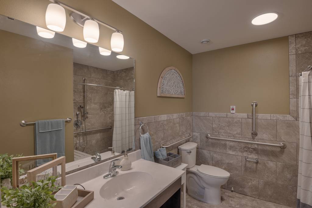 A well-lit bathroom with modern amenities