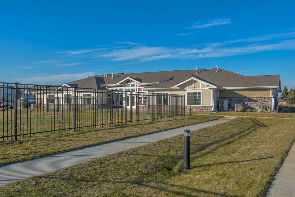 Exterior view of Northridge Village building with garden