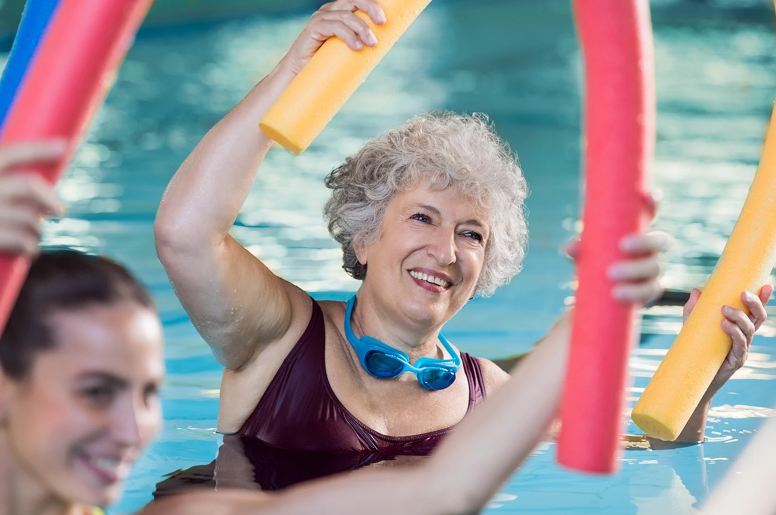 Residents participating in a water aerobics class