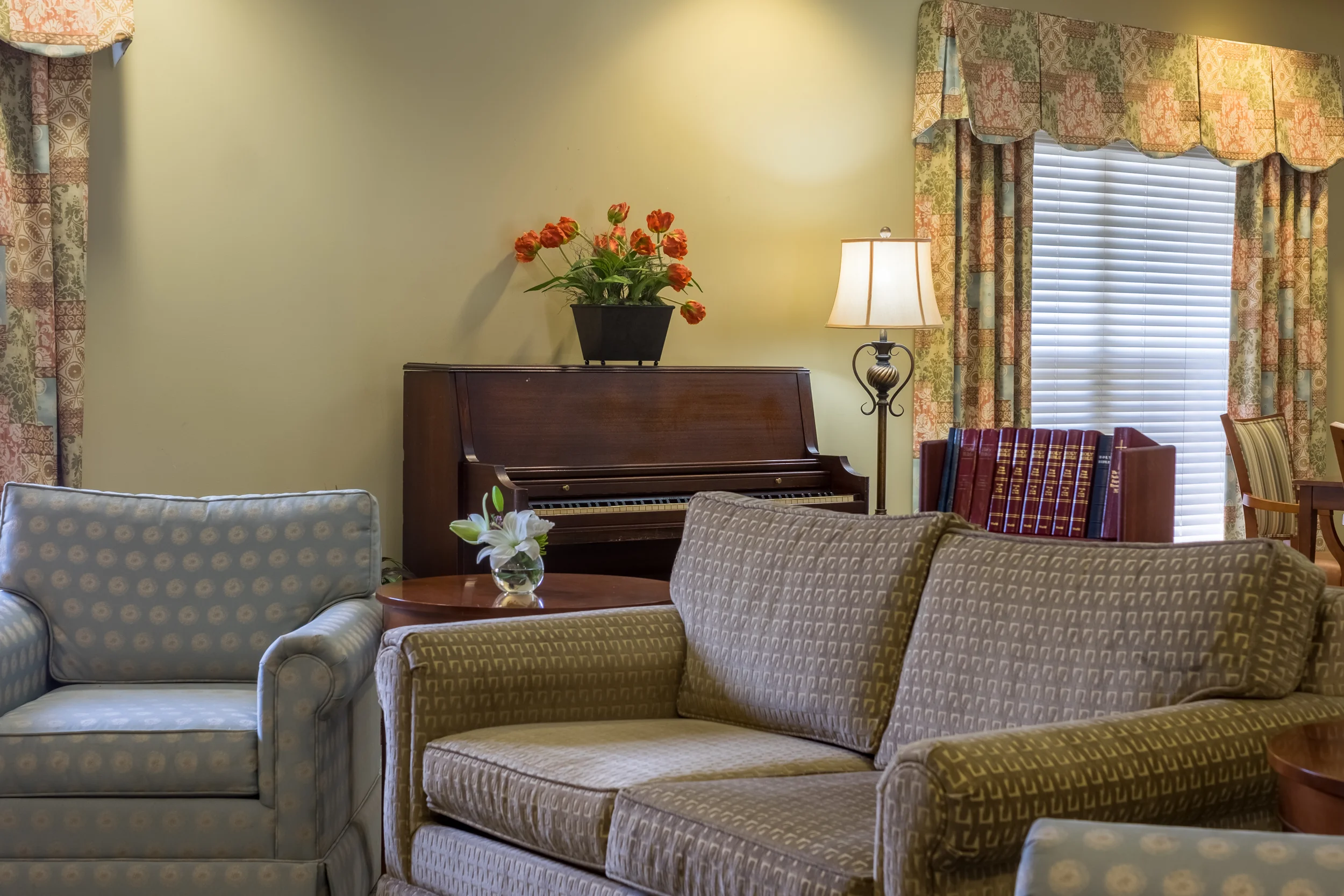 Cozy common area with seating and a piano