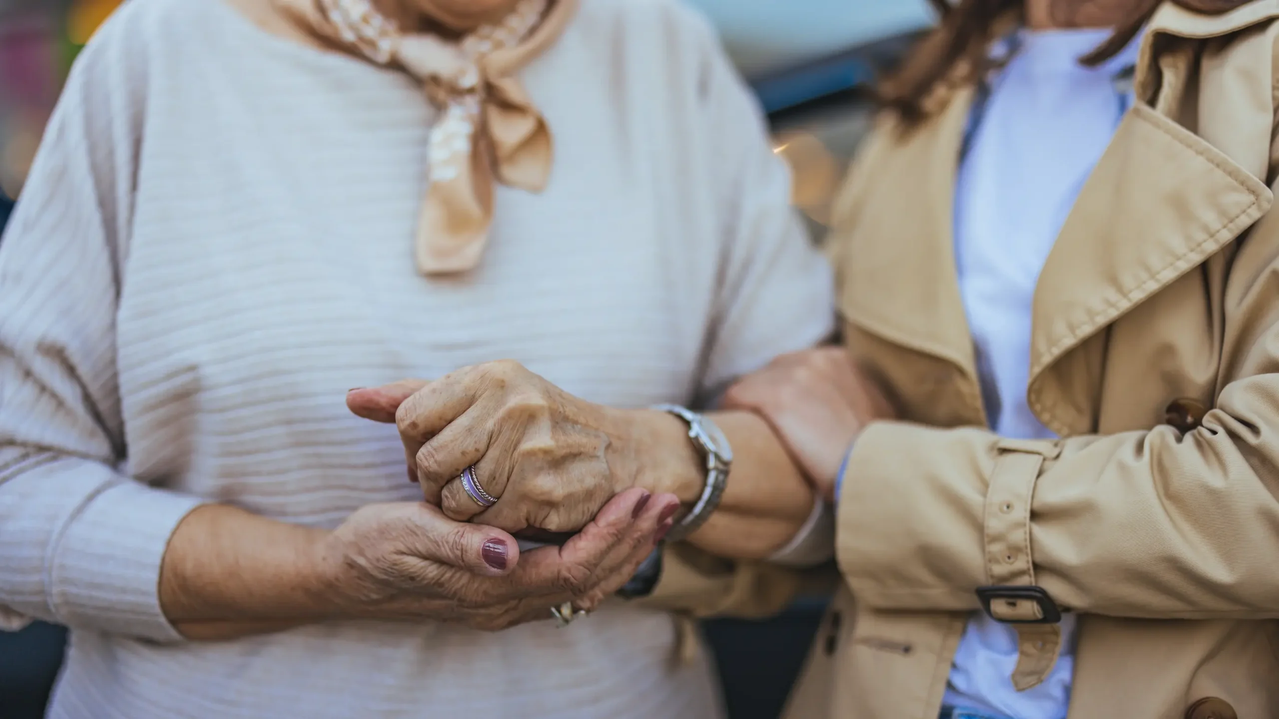 Two individuals holding hands, showing connection and support