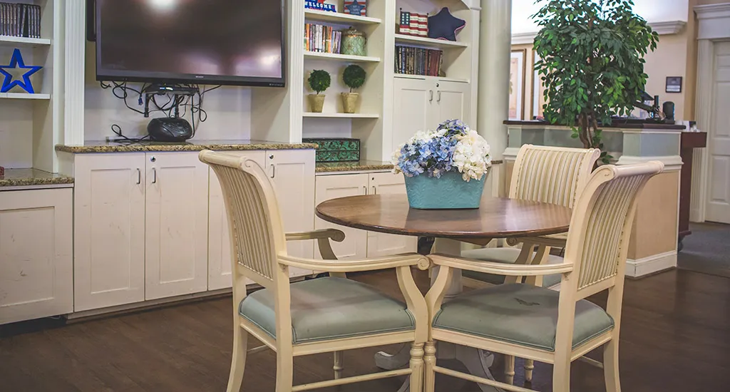 Interior common area with a table and floral arrangement