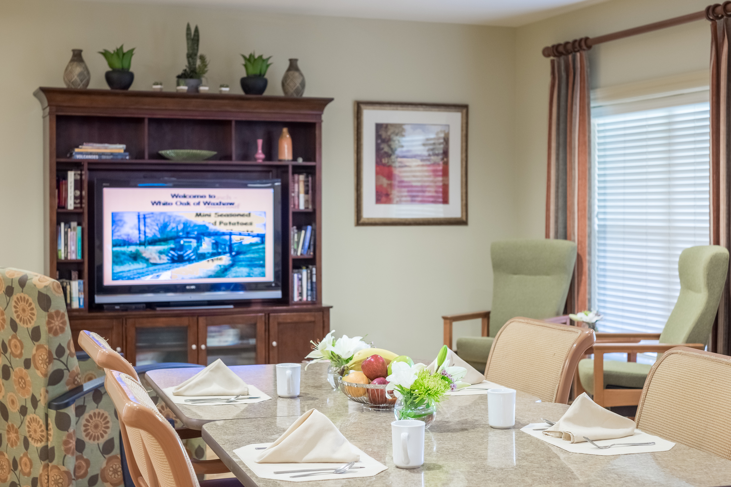 Dining table set up with refreshments in a common area