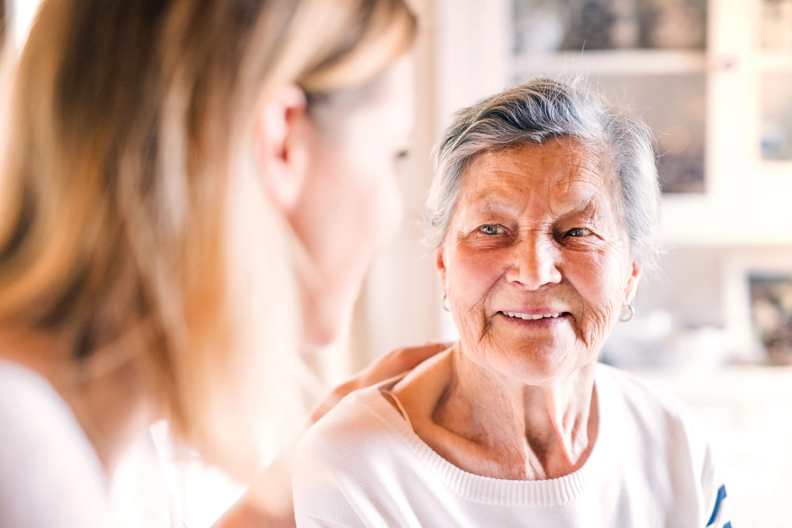 Resident smiling during a conversation with staff