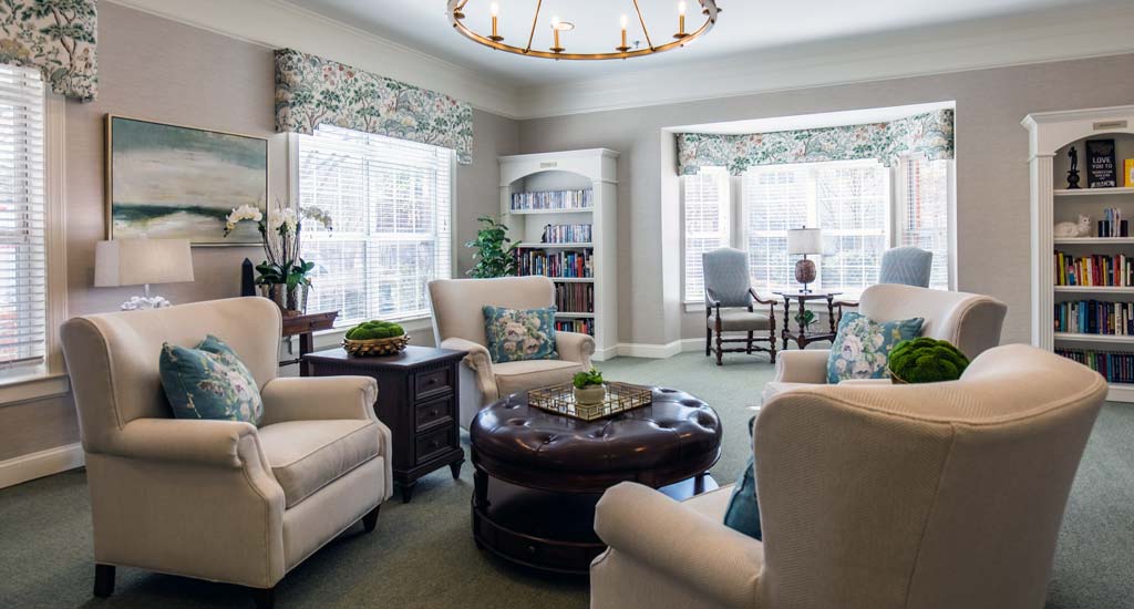 Cozy common area with seating and bookshelves