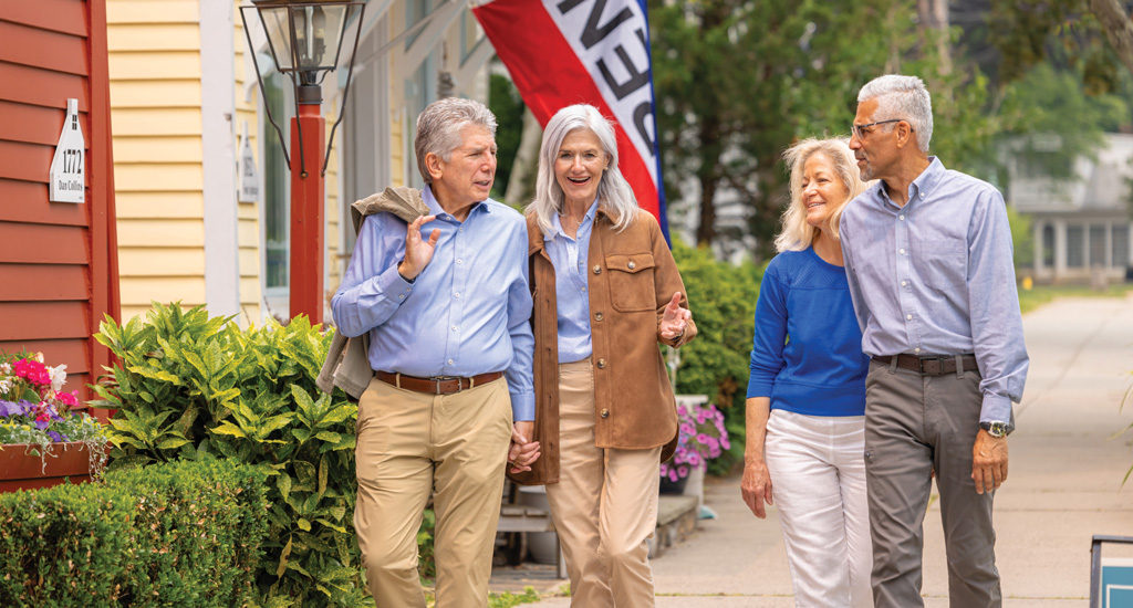 Residents enjoying a walk outside the facility