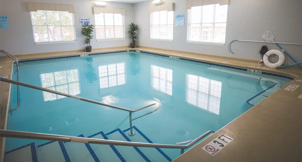 Indoor swimming pool with clear water and natural light