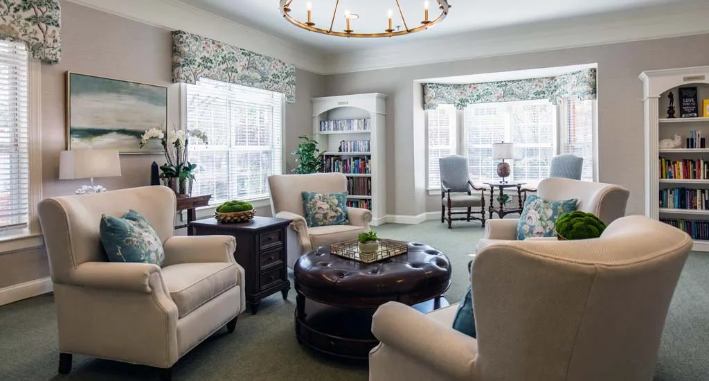 Cozy common area with seating and bookshelves