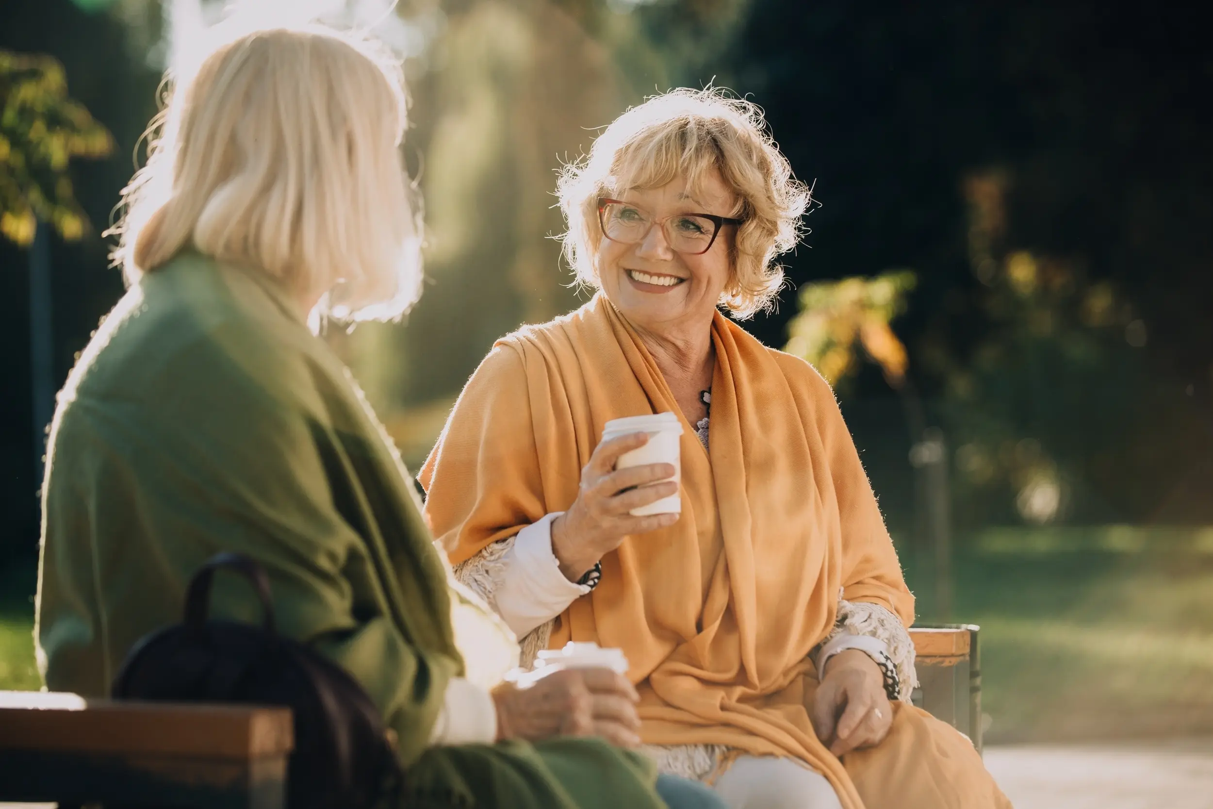 Two women enjoying conversation outdoors