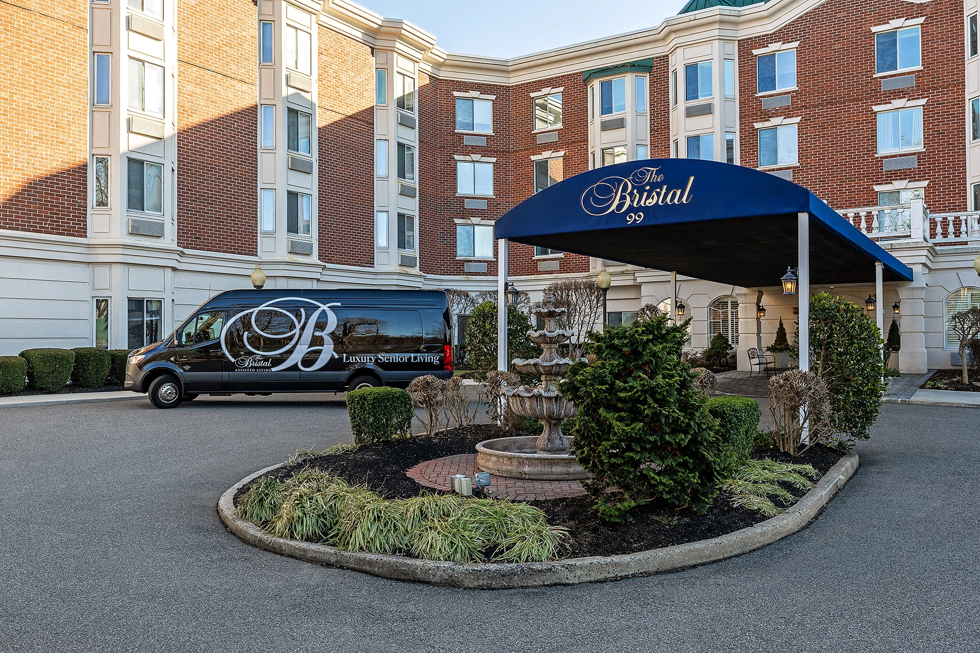 Exterior view of The Bristal Assisted Living facility with van