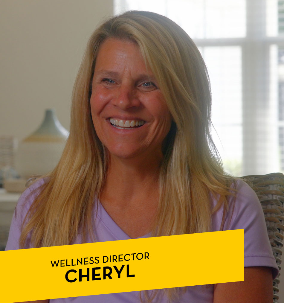 Wellness Director Cheryl smiling in common area