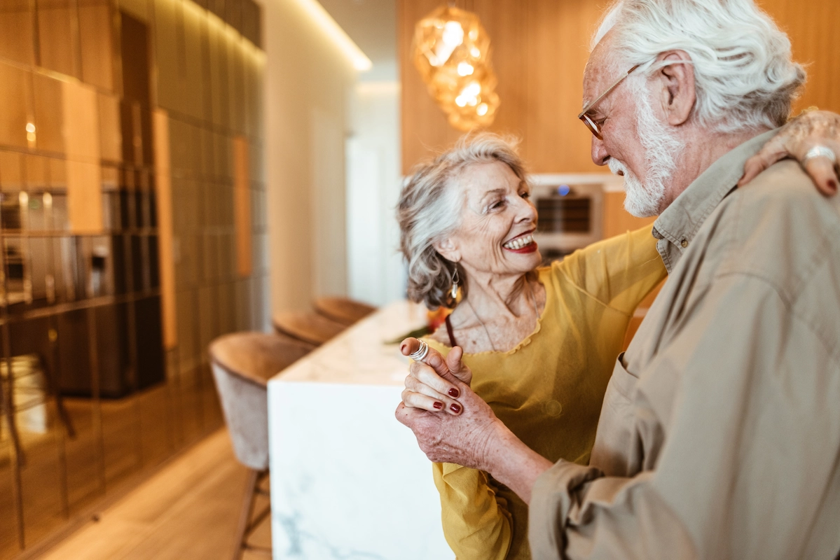 Couple dancing in a bright facility interior