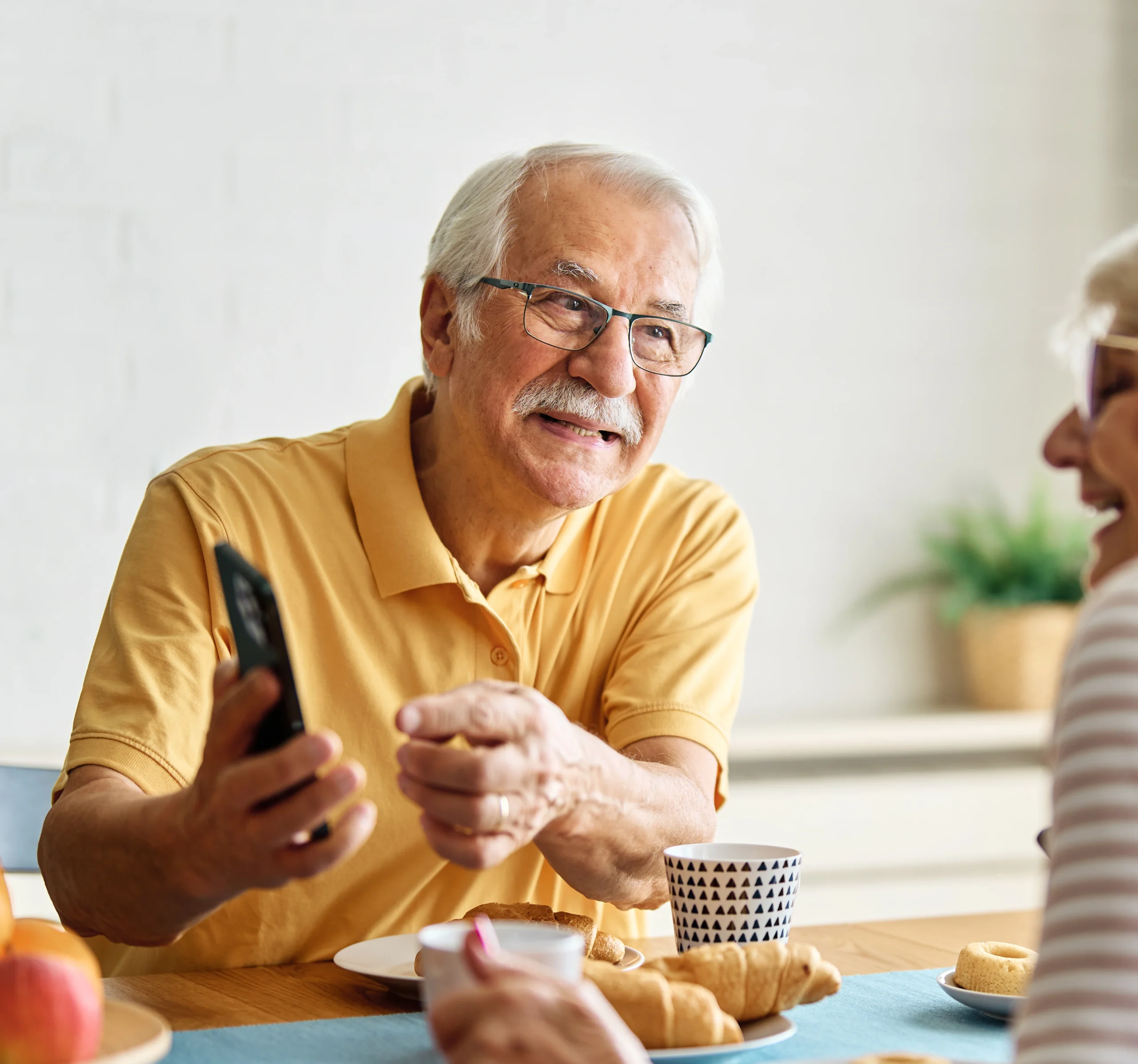 Residents enjoying a meal together in a social setting