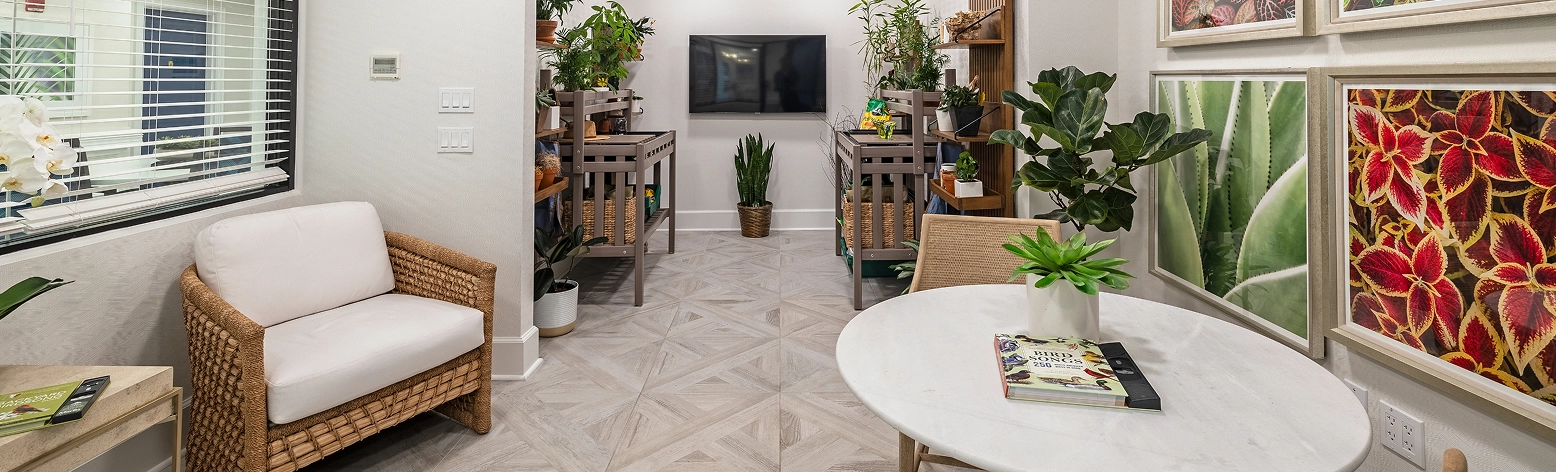Bright common area with plants and seating