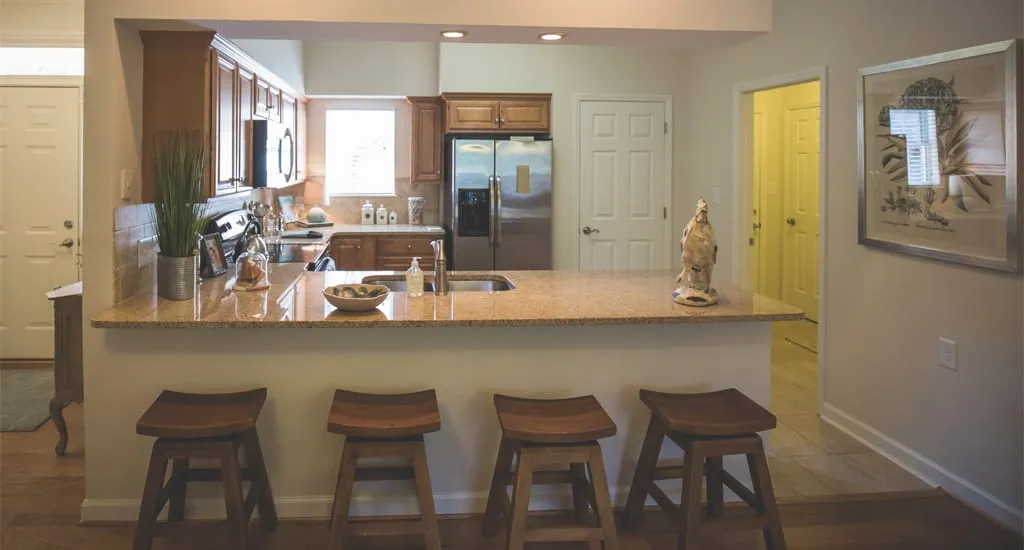 Bright kitchen space with granite countertops