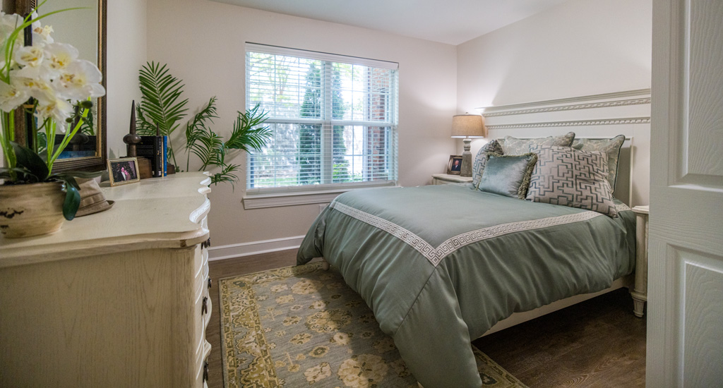 Cozy private room with a bed and decorative elements