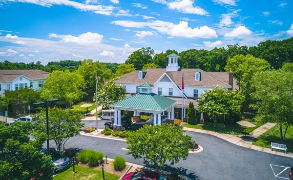 Aerial view of Homestead Hills with trees and blue sky