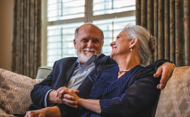 A couple enjoying a moment together in a cozy lounge