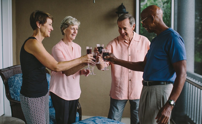 Residents raising glasses in a celebratory toast