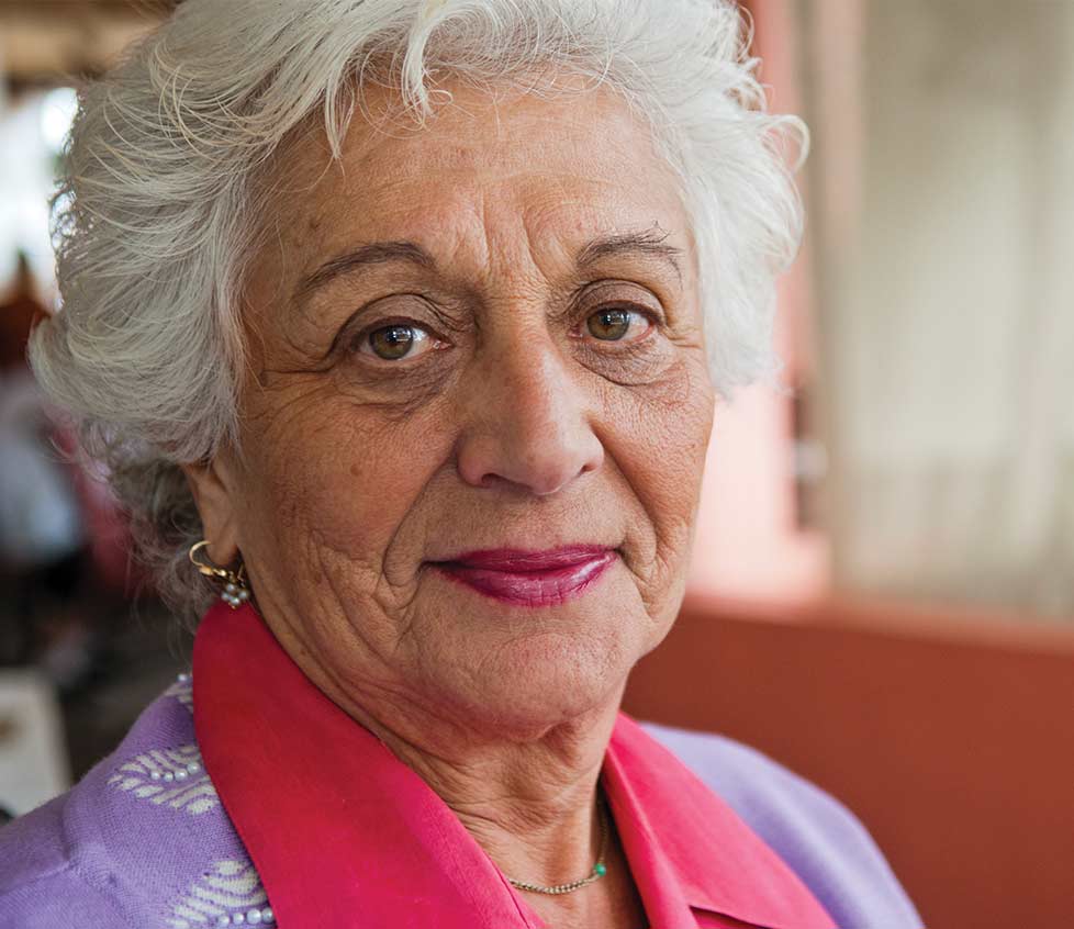 Close-up portrait of a smiling senior woman.