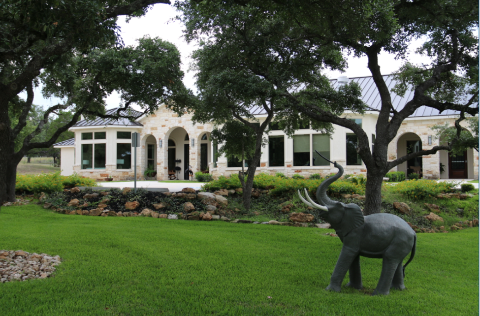 Exterior view of Garden Ridge Senior Living with elephant statue.