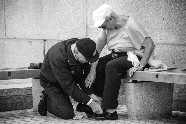 Staff assisting a senior with shoe