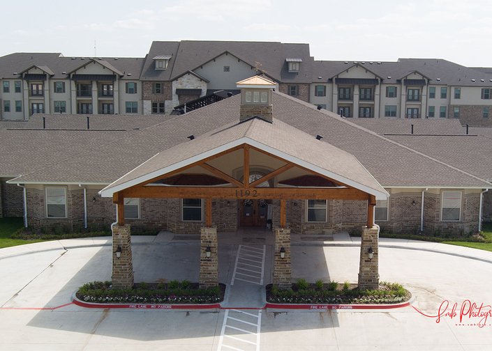 Exterior view of assisted living facility entrance.
