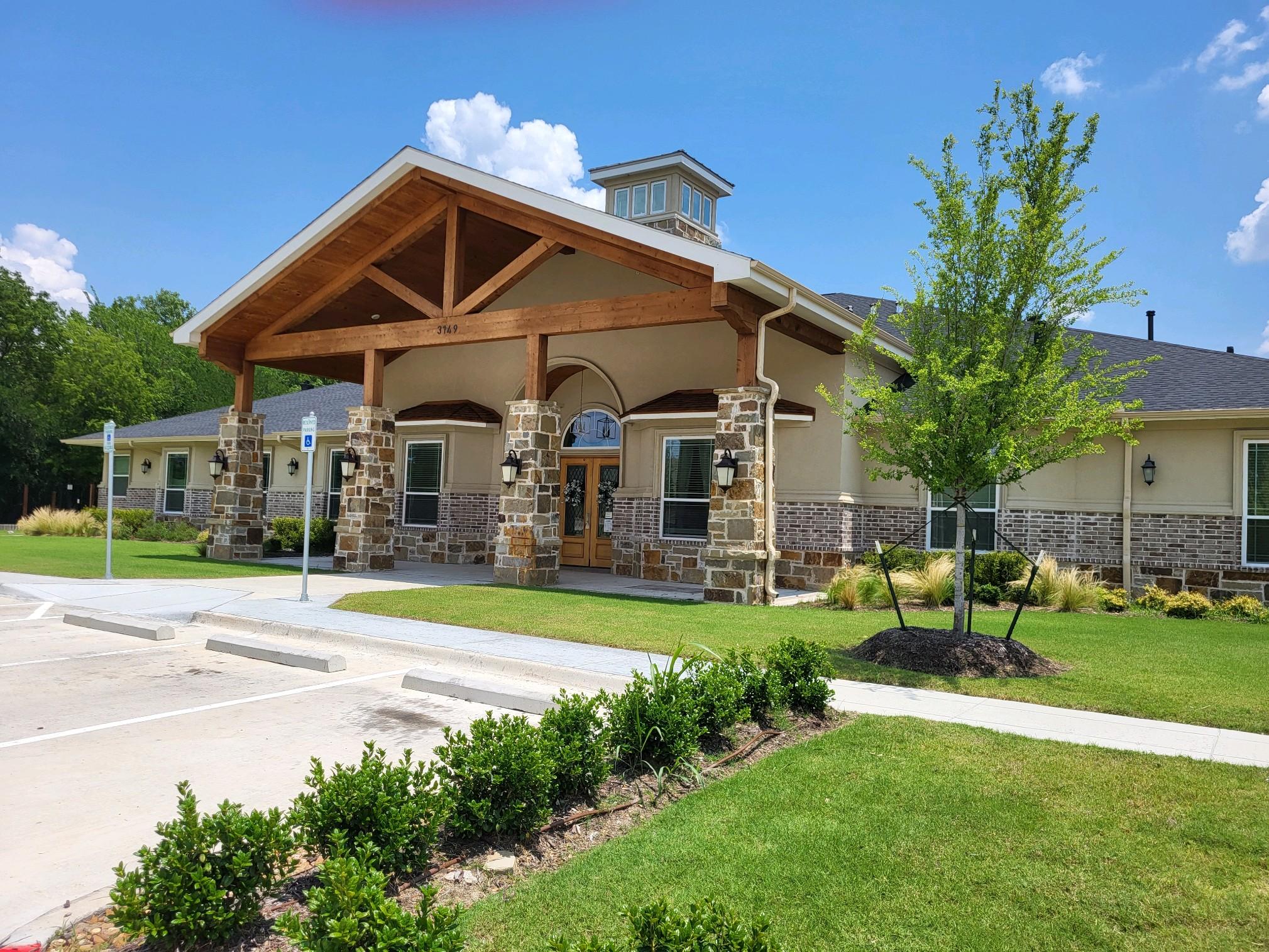 Exterior view of Village Green Assisted Living facility