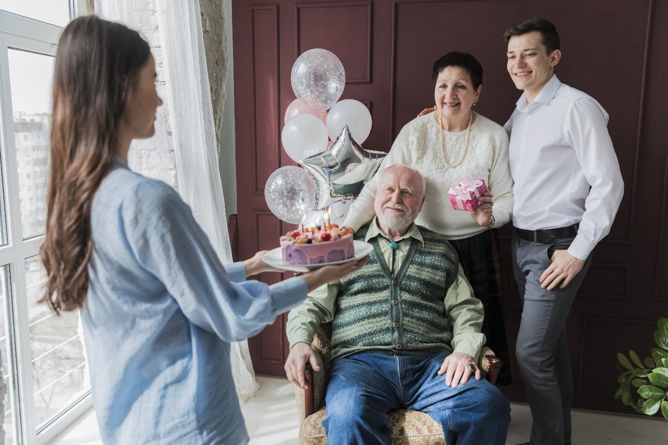 Celebration with a cake and happy residents