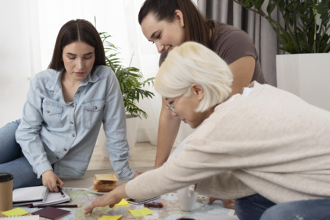 Three women collaborating on a project