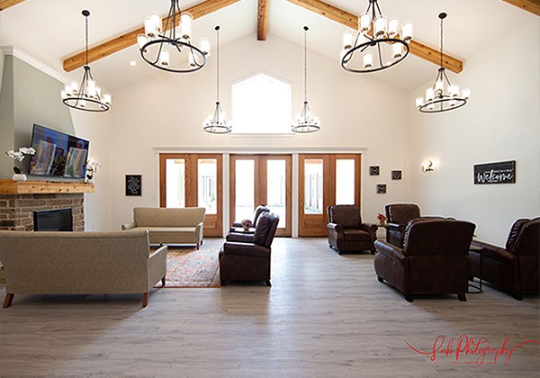 Interior common area with seating and welcoming decor.