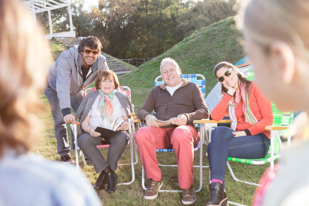 Residents enjoying time outdoors in chairs