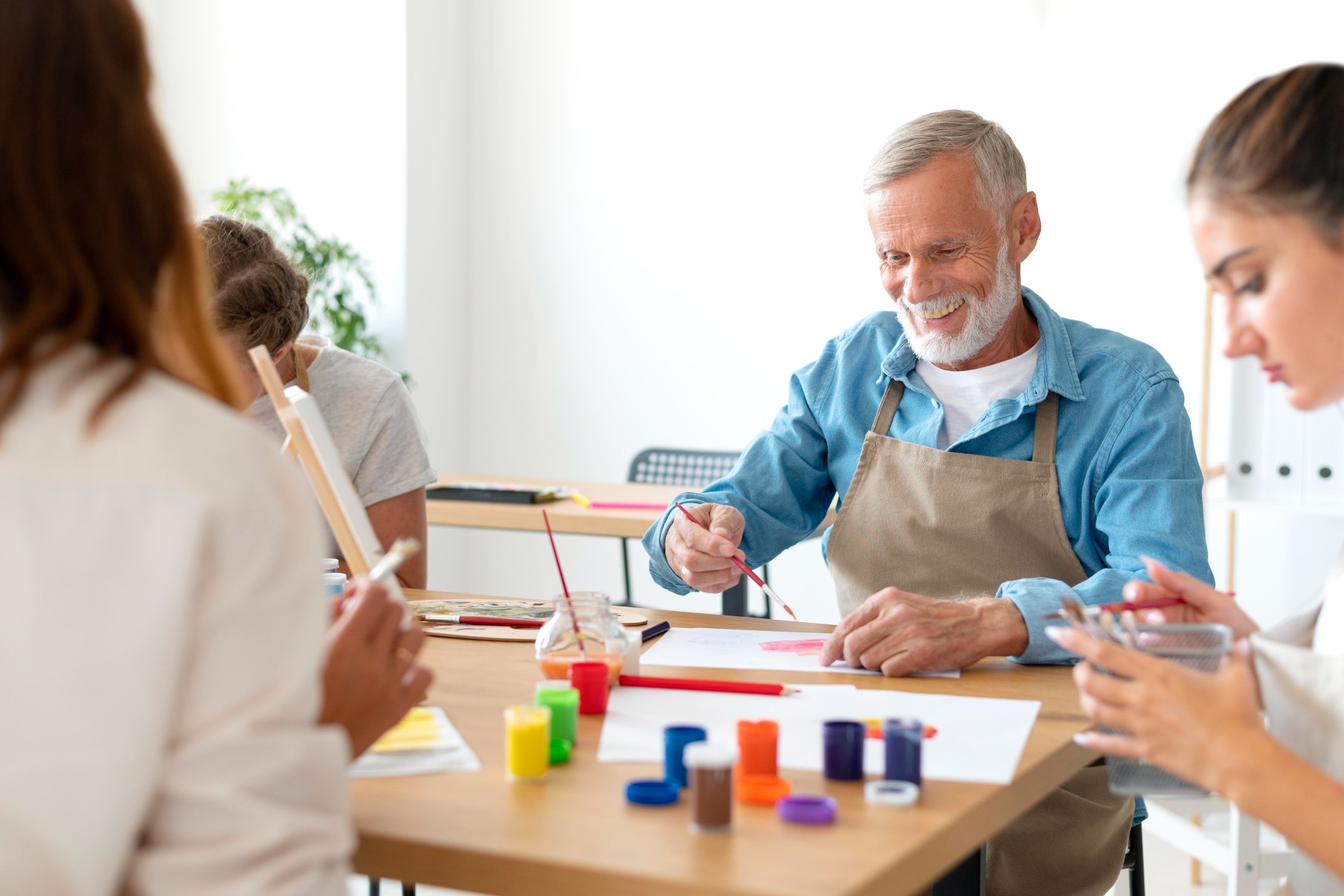 Residents engaged in a painting activity.