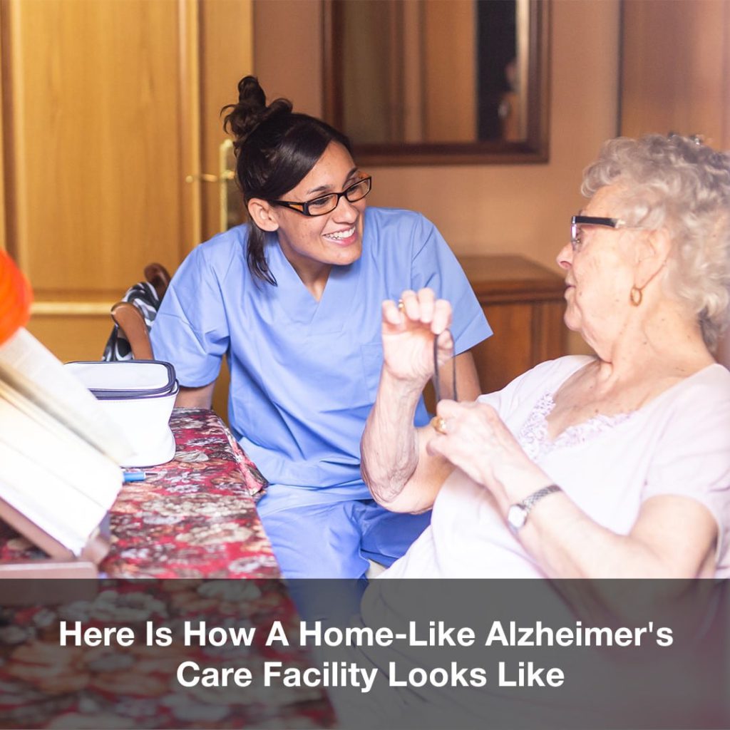 Staff member engaging with a resident in a cozy setting.
