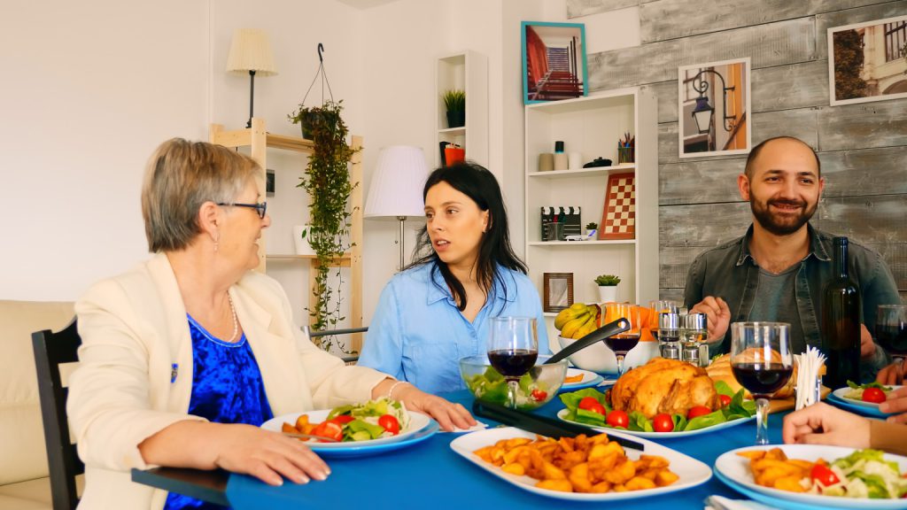 Residents enjoying a meal together at a dining table.