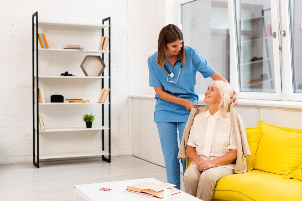 Caregiver interacting with a resident in a living area.